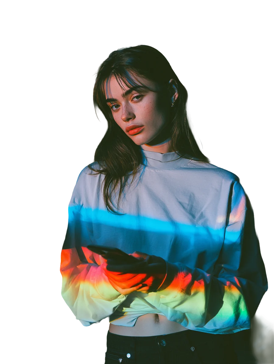 An affiliate partner checking her phone, a band of spectrum light falling across her